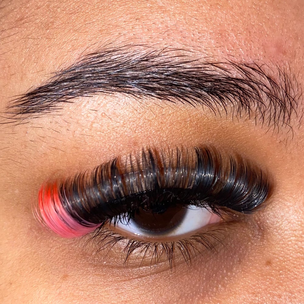 a volume russian style lash with hot pink at the ends