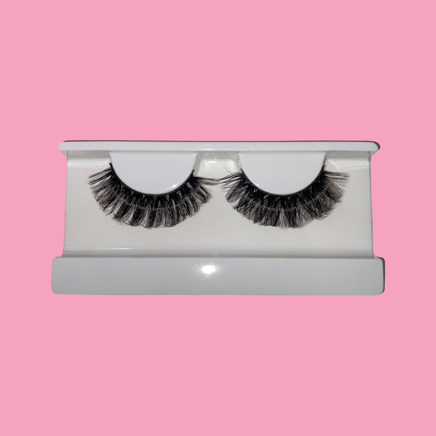a pair of wispy strip lashes